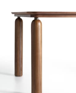 Detail of the round legs in canaletto walnut of the GO table