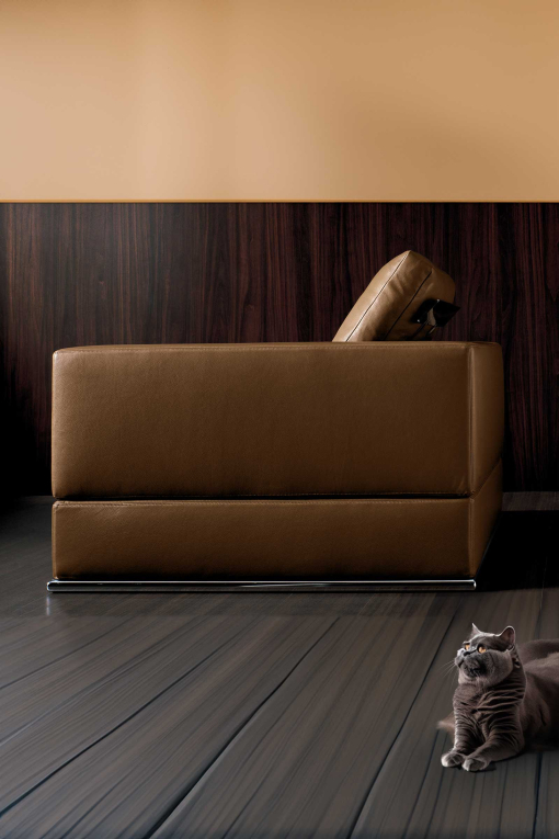 Brown leather armchair. Design Mauro Lipparini. High quality luxury furniture.