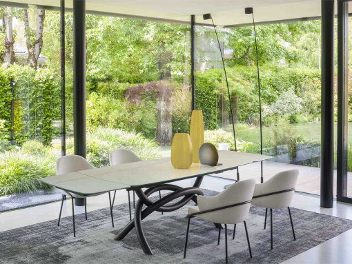 Extendable table. Sculptural metal base. Glass and ceramic top. Made in Italy and customizable. Buy quality tables with free delivery.