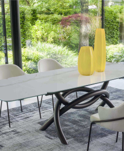 Extendable table. Sculptural metal base. Glass and ceramic top. Made in Italy and customizable. Buy quality tables with free delivery.