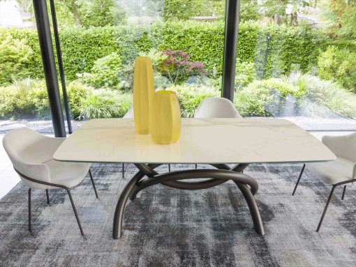 Extendable table. Sculptural metal base. Glass and ceramic top. Made in Italy and customizable. Buy quality tables with free delivery.