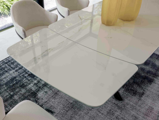 Extendable table. Sculptural metal base. Glass and ceramic top. Made in Italy and customizable. Buy quality tables with free delivery.