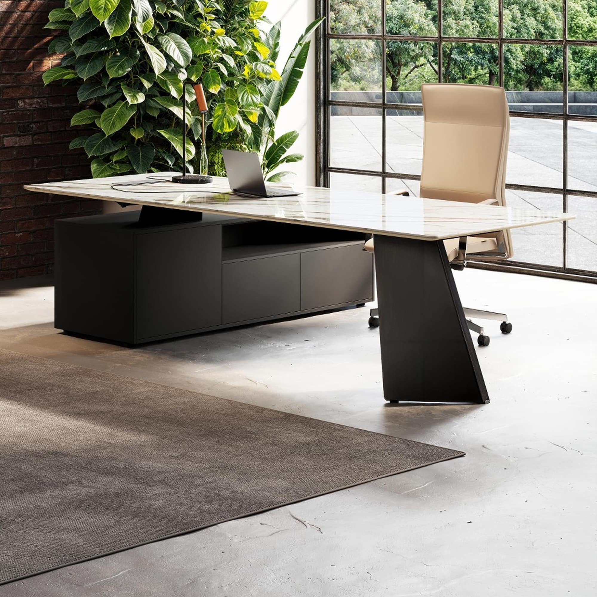 Angled view of the MONOLITH Calacatta Bianco desk with black supporting storage and a V-shaped metal leg.