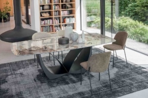Luxury dining room with marble-effect ceramic table, contemporary chairs and designer rug